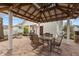 Charming brick patio with an elegant pergola and outdoor seating area, perfect for entertaining at 350 W Pearl St, Greenwood, IN 46142