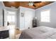 Comfortable bedroom with unique wood ceiling features a ceiling fan and comfortable bed at 356 S Washington St, Danville, IN 46122