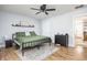 Bright bedroom with ceiling fan features a comfortable bed and ample natural light at 356 S Washington St, Danville, IN 46122