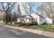 Beautiful house with lush yard, mature trees, and a 'for sale' sign posted near the street at 356 S Washington St, Danville, IN 46122