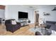 Comfortable living room with hardwood floors, large TV, and easy access to the kitchen at 356 S Washington St, Danville, IN 46122