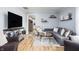 Cozy living room with hardwood floors, comfortable seating, and a view into the kitchen at 356 S Washington St, Danville, IN 46122