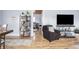 Open-concept space showcasing living room, bedroom, and dining area, with hardwood floors and natural light at 356 S Washington St, Danville, IN 46122