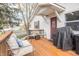 Cozy front porch featuring outdoor seating and a grill, perfect for relaxing or entertaining guests at 356 S Washington St, Danville, IN 46122