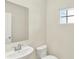 Powder room featuring a pedestal sink, toilet, and a window for natural light at 3727 Thomas Jefferson Ct, Westfield, IN 46074