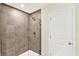Modern bathroom featuring a glass-enclosed shower with tile surround and brushed nickel fixtures at 3727 Thomas Jefferson Ct, Westfield, IN 46074