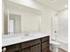 Bright bathroom with a large mirror, modern vanity, and a shower-tub combo at 3727 Thomas Jefferson Ct, Westfield, IN 46074