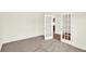 Comfortable bedroom featuring soft carpeting, white walls, and glass panel doors at 3727 Thomas Jefferson Ct, Westfield, IN 46074
