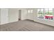 Bright bedroom featuring carpet, a window with a view, and an open doorway to another room in the home at 3727 Thomas Jefferson Ct, Westfield, IN 46074