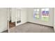 Bright bedroom with plush carpeting, white trim, and large windows providing ample natural light at 3727 Thomas Jefferson Ct, Westfield, IN 46074