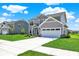 Beautiful two-story home with a large driveway, manicured lawn, and a well-maintained yard at 3727 Thomas Jefferson Ct, Westfield, IN 46074