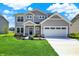 Charming two-story home with a well-manicured lawn and a two-car garage at 3727 Thomas Jefferson Ct, Westfield, IN 46074