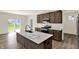 Gourmet kitchen island with stainless steel appliances, ample countertop space, and wood cabinetry at 3727 Thomas Jefferson Ct, Westfield, IN 46074
