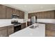 The kitchen has a kitchen island, stainless steel appliances, and a white subway tile backsplash at 3727 Thomas Jefferson Ct, Westfield, IN 46074