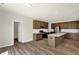 This kitchen features wood floors, stainless steel appliances, a walk-in pantry, and an island at 3727 Thomas Jefferson Ct, Westfield, IN 46074