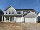 Beautiful two-story home with a three-car garage and stone accents under construction at 3847 Thomas Jefferson Ct, Westfield, IN 46074