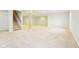 Spacious basement with neutral carpet, white walls, and support beams, offering a versatile living area at 3932 Long Ridge Blvd, Carmel, IN 46074