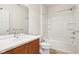 Full bathroom featuring a combination tub and shower, and a cherry vanity with a cultured marble sink at 3932 Long Ridge Blvd, Carmel, IN 46074
