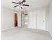 Neutral bedroom with a ceiling fan, carpet flooring, closet, and ensuite bathroom at 3932 Long Ridge Blvd, Carmel, IN 46074