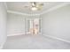 Empty bedroom with neutral carpet, crown molding, and French doors at 3932 Long Ridge Blvd, Carmel, IN 46074