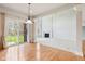 Formal dining area with hardwood floors, slider door and an open concept living area at 3932 Long Ridge Blvd, Carmel, IN 46074