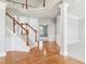 Open foyer featuring hardwood floors, staircase, and access to spacious rooms at 3932 Long Ridge Blvd, Carmel, IN 46074