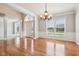 Bright foyer boasts hardwood floors, arched window over front door, and white trim at 3932 Long Ridge Blvd, Carmel, IN 46074