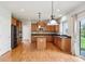 Spacious kitchen with wooden cabinets, granite countertops, and stainless steel appliances at 3932 Long Ridge Blvd, Carmel, IN 46074