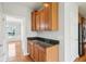 Kitchen nook featuring granite countertops and wooden cabinets at 3932 Long Ridge Blvd, Carmel, IN 46074