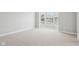 Bright, carpeted room with a bay window providing ample natural light at 3932 Long Ridge Blvd, Carmel, IN 46074