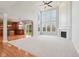 Spacious living room with fireplace, soaring windows, ceiling fan and eat-in kitchen at 3932 Long Ridge Blvd, Carmel, IN 46074