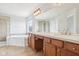 Main bathroom featuring a shower, soaking tub, dual sink vanity, and tile floors at 3932 Long Ridge Blvd, Carmel, IN 46074