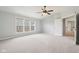 Spacious main bedroom features a ceiling fan, carpet, and large windows at 3932 Long Ridge Blvd, Carmel, IN 46074