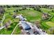 Aerial view of clubhouse, parking lot and golf carts on a sunny day at 3991 Clubhouse Dr, Greenfield, IN 46140