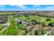 Scenic aerial view showcasing property near golf course, mature trees, and lush landscaping at 3991 Clubhouse Dr, Greenfield, IN 46140