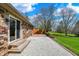 Backyard featuring a stone patio and mature landscaping perfect for relaxing at 3991 Clubhouse Dr, Greenfield, IN 46140