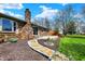 Backyard featuring a stone pathway and well-manicured landscaping, enhancing the home's appeal at 3991 Clubhouse Dr, Greenfield, IN 46140