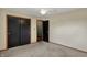 Bright bedroom featuring neutral carpet and a window overlooking greenery at 3991 Clubhouse Dr, Greenfield, IN 46140
