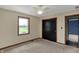 Bright bedroom featuring neutral carpet and a window overlooking greenery at 3991 Clubhouse Dr, Greenfield, IN 46140