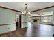The dining room offers an open layout with wood floors connecting to a fireplace and a kitchen at 3991 Clubhouse Dr, Greenfield, IN 46140