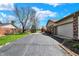 Exterior of home, featuring a long asphalt driveway and 3-car garage at 3991 Clubhouse Dr, Greenfield, IN 46140