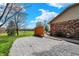 Brick home featuring a well-maintained gravel driveway and beautiful golf course views at 3991 Clubhouse Dr, Greenfield, IN 46140
