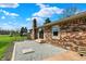 Exterior of home, featuring brick, a stone patio and large backyard at 3991 Clubhouse Dr, Greenfield, IN 46140