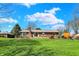 Well-maintained brick home with a manicured front lawn and inviting curb appeal at 3991 Clubhouse Dr, Greenfield, IN 46140
