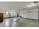Spacious three car garage featuring neutral paint, a smooth concrete floor, and bright lighting at 3991 Clubhouse Dr, Greenfield, IN 46140