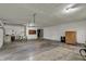 Spacious three car garage with smooth concrete floor and bright overhead lighting at 3991 Clubhouse Dr, Greenfield, IN 46140