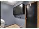 Functional laundry room featuring tile flooring, overhead cabinets, and neutral paint colors at 3991 Clubhouse Dr, Greenfield, IN 46140