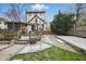 Spacious backyard with deck, patio, fire pit, mature trees, and landscaping, creating a private oasis at 40 N Ritter Ave, Indianapolis, IN 46219