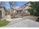 Expansive backyard featuring a stone patio, wooden deck, and landscaped areas, perfect for entertaining at 40 N Ritter Ave, Indianapolis, IN 46219