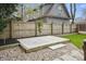 Concrete backyard patio offers a versatile space for outdoor activities with a privacy fence and lush landscaping at 40 N Ritter Ave, Indianapolis, IN 46219